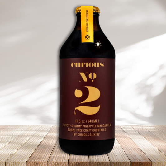 Curious No 2 bottle on wooden platform against white background